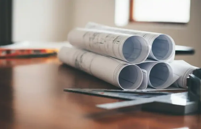 neatly rolled set of architectural blueprints